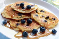 Blueberry and ricotta pancakes with blueberry and ginger sauce